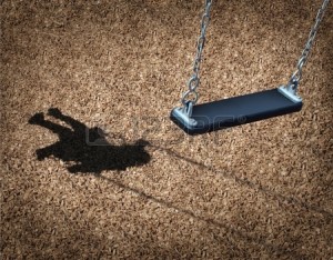 20688379-missing-child-concept-with-an-empty-playground-swing-and-the-shadow-of-a-little-girl-on-the-park-flo